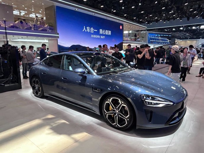 25 April 2024, China, Beijing: The SU7 from Chinese cell phone manufacturer Xiaomi is on display at the 18th Beijing International Automotive Exhibition also known as Auto China.