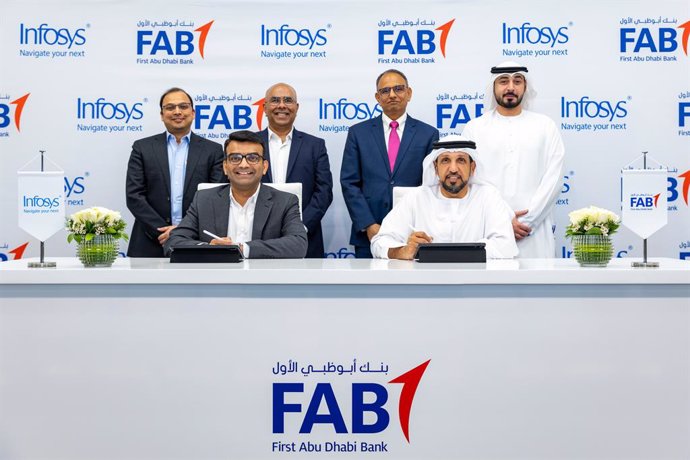 Infosys signs a strategic collaboration agreement with First Abu Dhabi Bank. Signatories (bottom row L-R): Dennis Gada, Executive Vice President and Global Head of Banking & Financial Services, Infosys and Suhail Bin Tarraf, Group Chief Operating Officer,