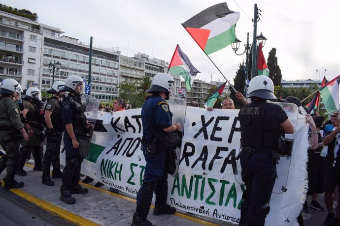 May 7, 2024, Athens, Greece: Protesters chant slogans at Police right after Riot Police has hurled tear gas, during a pro-Palestinian demonstration against Israeli actions in Rafah.