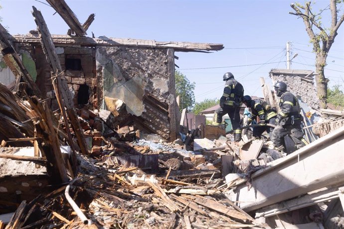 May 3, 2024, Kharkiv, Kharkiv, Ukraine: First responders work at the site after a Russian attack on Kharkiv. Preliminary data reveals the loss of an 82-year-old woman, bedridden due to illness, as a direct result of the attack. At least 12 private homes s