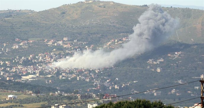 KAFR KILA, May 11, 2024  -- The smoke caused by an Israeli strike rises in Kafr Kila, Lebanon, May 10, 2024. A member of the Lebanese armed group Hezbollah was killed and a civilian wounded on Friday at dawn in an Israeli raid targeting the southeastern L