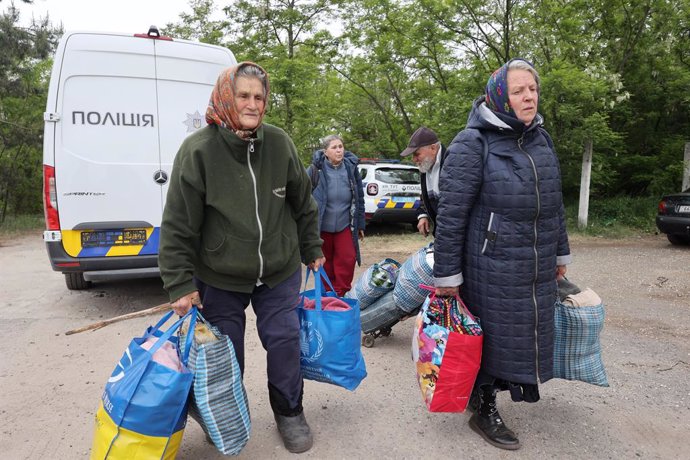 May 17, 2024, Kharkiv Region, Ukraine: KHARKIV REGION, UKRAINE - MAY 17, 2024 - Elderly women carry bags with their belongings during the evacuation from Vovchansk which is under constant Russian shelling, Kharkiv region, northeastern Ukraine.