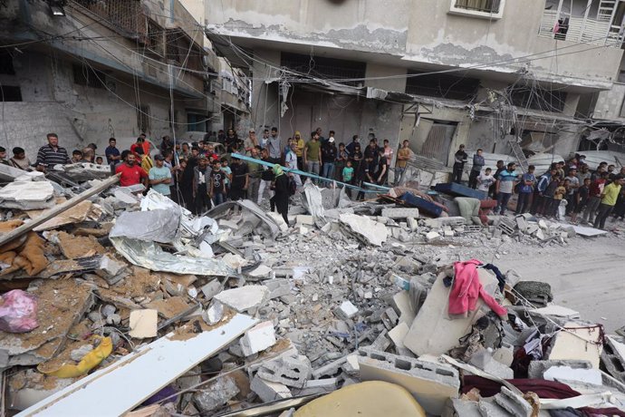 GAZA, May 14, 2024  -- People gather at the site of an Israeli airstrike in the Nuseirat refugee camp, central Gaza Strip, on May 14, 2024. At least 40 people were killed and others injured after midnight Monday by Israeli bombardment in the Nuseirat refu