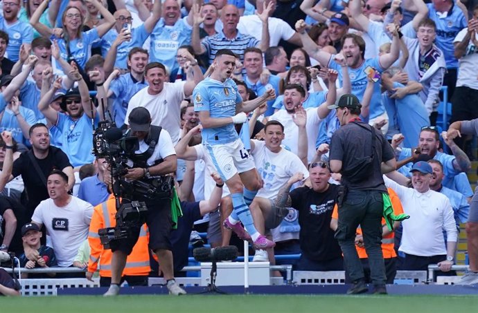 19 May 2024, United Kingdom, Manchester: Manchester City's Phil Foden celebrates scoring his side's second goal during the English Premier League soccer match between Manchester City and West Ham United at the Etihad Stadium. Photo: Martin Rickett/PA Wire