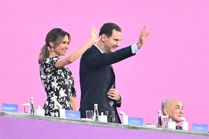 Archivo - El presidente de Siria, Bashar al Assad, junto a su esposa, Asma al Assad, durante la inaguración de los Juegos Asiáticos, celebrados en China en septiembre de 2023 (archivo)