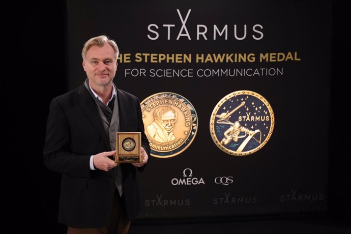 Christopher Nolan with the Stephen Hawking Medal Acclaimed filmmaker Christopher Nolan holds the Stephen Hawking Medal for Science Communication, awarded for his thought-provoking films that explore deep scientific themes, such as "Interstellar" and "Tene