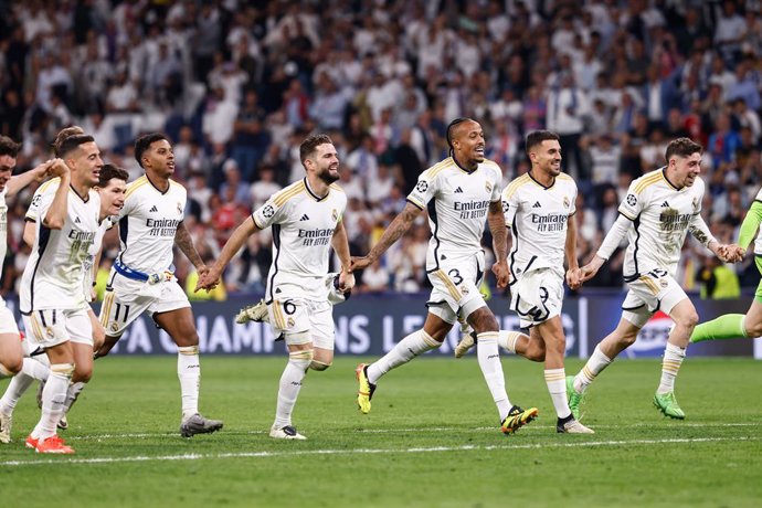 Players of Real Madrid celebrate the 2-1 victory and the pass to the Final during the UEFA Champions League.