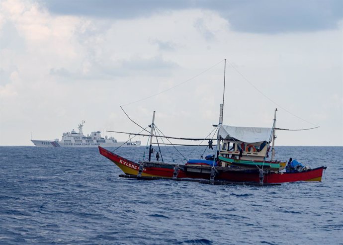 May 16, 2024, Scarborough Shoal Vicinity, Zambales, philippines: A civilian fishing boat F/B Kylene (front) and China Coast Guard vessel 4203 shadowing during the civilian resupply mission to bring supplies and assistance to the fishermen in Scarborough S