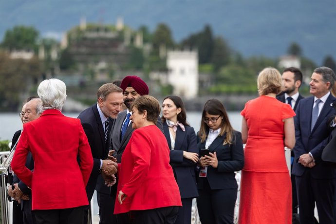 24 May 2024, Italy, Stresa: Christian Lindner (C), Germany's Minister of Finance, welcomes Kristalina Georgiewa, Managing Director of the International Monetary Fund, to Lake Maggiore. Photo: Hannes P. Albert/dpa