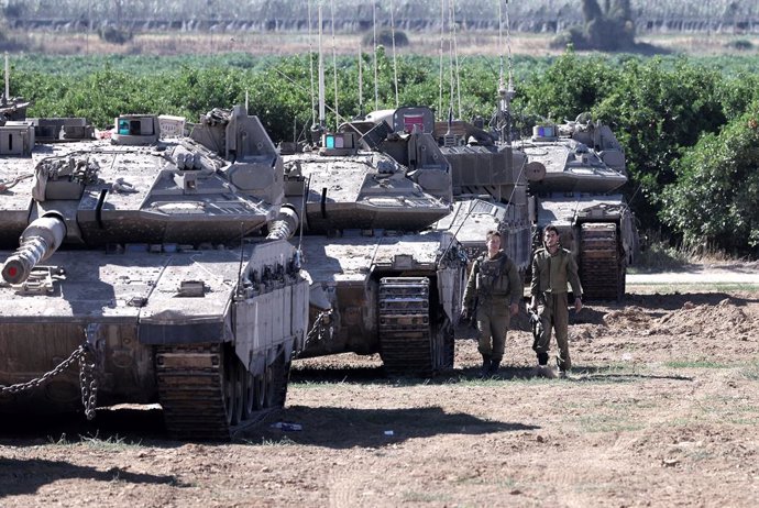 KEREM SHALOM CROSSING, May 8, 2024  -- Israeli armored vehicles are deployed near the Kerem Shalom crossing in southern Israel, on May 8, 2024. Israel's army announced on Wednesday that it was continuing its ground assault on Gaza's Rafah, reporting appro