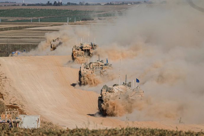 FILED - 29 May 2024, Palestinian Territories, Rafah: Israeli military vehicles continue on the border line near the city of Rafah, Gaza. At least 45 people were killed, mostly women and children, and nearly 250 others injured in the Israeli strike on the 