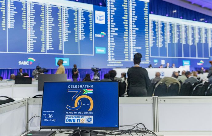 JOHANNESBURG, May 31, 2024  -- Staff members of the Independent Electoral Commission (IEC) work at the National Results Operations Center in Midrand, South Africa, on May 31, 2024. The ruling African National Congress (ANC) is currently leading in South A