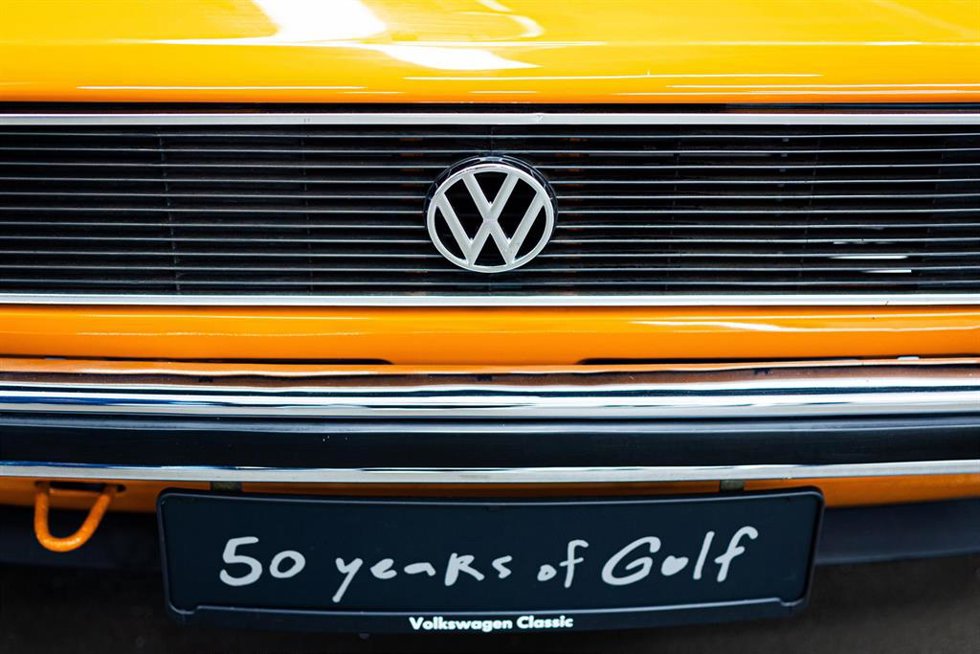 03 June 2024, Lower Saxony, Wolfsburg: A Volkswagen Golf decorated with the words "50 years of Golf" stands at the "50 years of Golf production" ceremony at the VW plant. Photo: Moritz Frankenberg/dpa