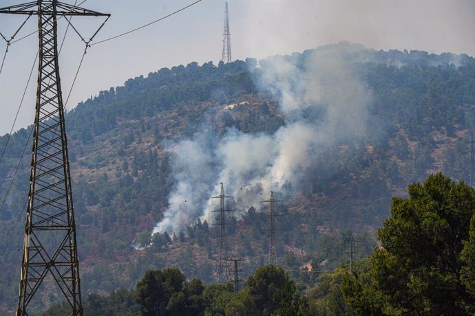 KIRYAT SHMONA, June 4, 2024  -- Smoke rises after rocket attacks from Lebanon near Kiryat Shmona, northern Israel, on June 4, 2024. Deputy Secretary-General of Hezbollah Sheikh Naim Qassem said on Tuesday that the Lebanese armed group is ready to face a c