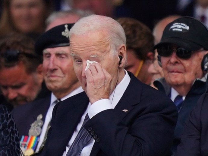 06 June 2024, France, Saint-Laurent-Sur-Mer: US President Joe Biden reacts during the official international ceremony to mark the 80th anniversary of D-Day on Omaha Beach. Photo: Jordan Pettitt/PA Wire/dpa