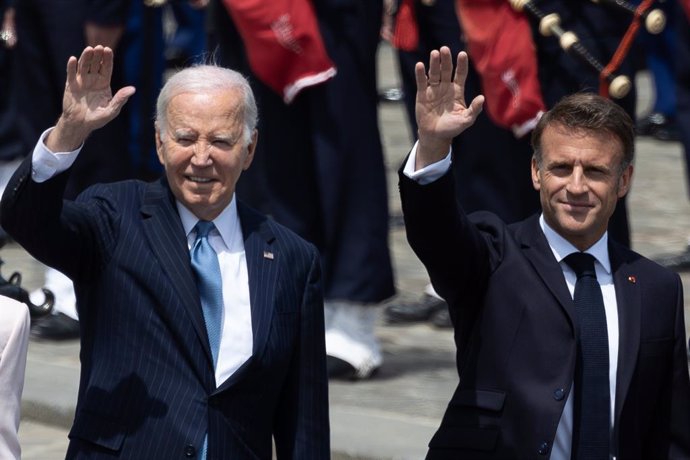 June 8, 2024, Paris, France, France: France s President Emmanuel Macron and US President Joe Biden waves as they attend a ceremony at the Arc of Triomphe. US President Joe Biden is due to meet Macron for talks at the Elysee Palace in Paris followed by a s