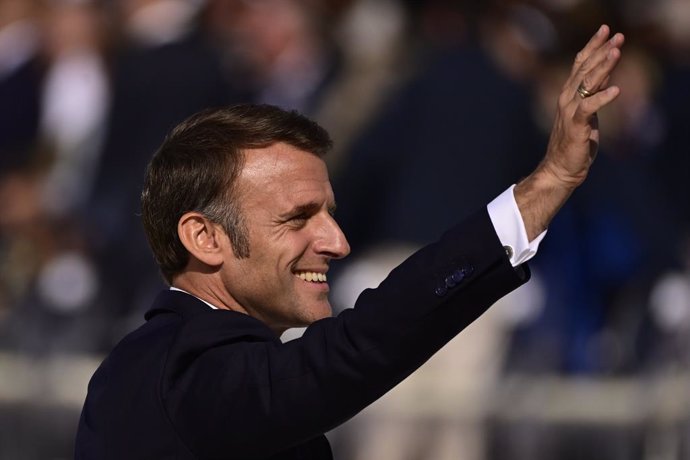 06 June 2024, France, Saint-Laurent-Sur-Mer: President of France Emmanuel Macron waves during an international ceremony on Omaha Beach in the context of the commemoration of the 80th anniversary of the Normandy landings, in Saint-Laurent-sur-Mer, France. 