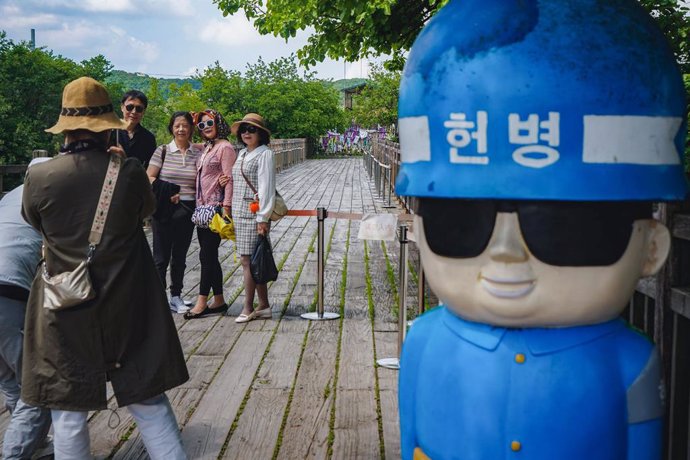 May 18, 2024, Paju, South Korea: Visitors seen posing on the Bridge of Freedom near the demilitarized zone at Paju, South Korea. The demilitarized zone (DMZ) has served as a buffer zone between North Korea and South Korea after the outbreak of Korean war 