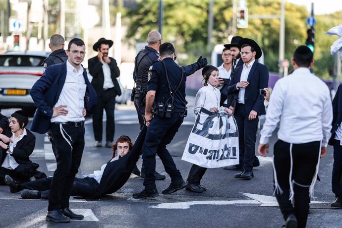 June 2, 2024, Jerusalem, Israel: Police officers remove ultra-Orthodox Jews blocking the road during a protest against military conscription outside the Israeli Supreme Court. Israel's Supreme Court hears on 02 June a response by the state over the ultra 