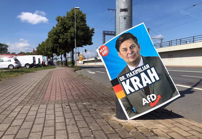 FILED - 10 June 2024, Thuringia, Erfurt: An election poster depicting AfD politician Maximilian Krah hangs on a lamp post on the ground. The far-right Identity and Democracy (ID) group in the European Parliament currently has no plans to readmit the Alter