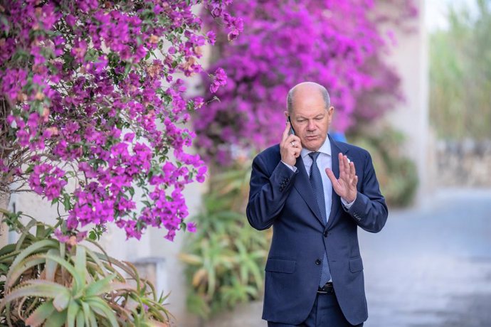 13 June 2024, Italy, Fasano: German Chancellor Olaf Scholz speaks on the phone at the G7 summit. Photo: Michael Kappeler/dpa