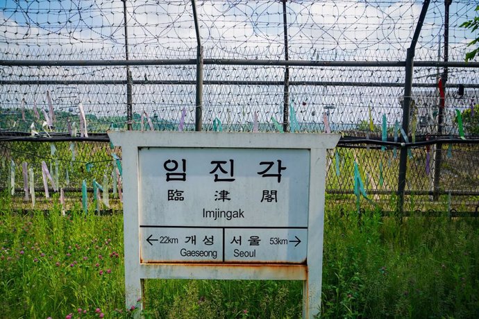 May 18, 2024, Paju, South Korea: A train station sign depicting the location of Imjingak is seen against a fence near the demilitarized zone in Paju, South Korea. The demilitarized zone (DMZ) has served as a buffer zone between North Korea and South Korea