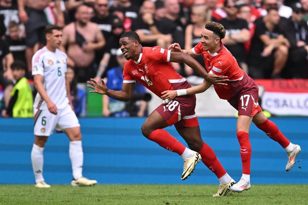 15 June 2024, North Rhine-Westphalia, Cologne: Switzerland's Kwadwo Duah celebrates scoring his side's first goal with team mate Ruben Vargas during the UEFA EURO 2024 Group A soccer match between Hungary and Switzerland at Cologne Stadium. Photo: Mariu