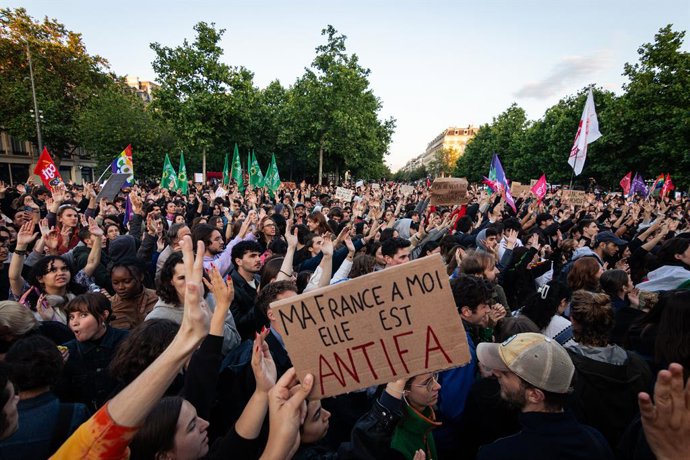June 11, 2024, Paris, France: A protester holds a placard that says ''My France is Antifa'' amidst the crowd during the demonstration. Following the victory of Jordan Bardella of the Rassemblement National party in the European elections on 9 June and Fre