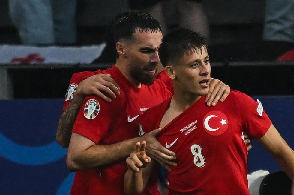 18 June 2024, North Rhine-Westphalia, Dortmund: Georgia's Arda Guler celebrates scoring his side's second goal with teammate Orkun Kokcu during the UEFA EURO 2024 Group F soccer match between Turkey and Georgia at the Signal Iduna Park. Photo: Bernd Thi