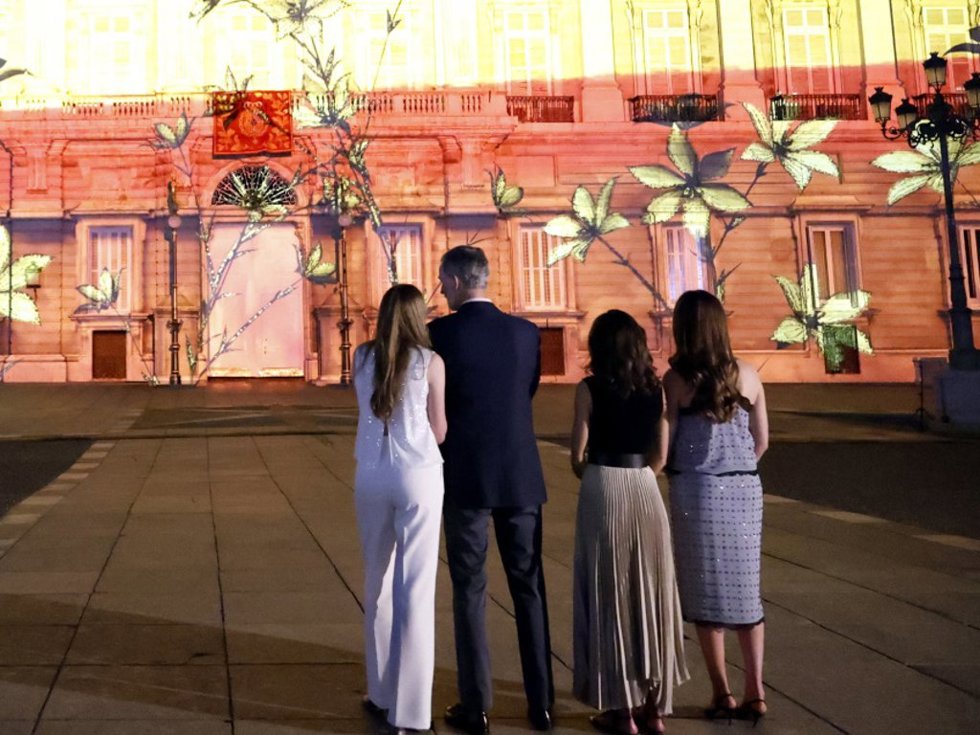 (I-D) La Infanta Sofía; El Rey Felipe VI; La Reina Letizia Y La Princesa Leonor Observan La Proyección De Un Videomapping Por El X Aniversario De La Proclamación Del Rey Felipe VI.