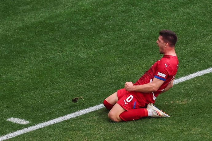 20 June 2024, Bavaria, Munich: Serbia's Luka Jovic celebrates scoring his side's first goal during the UEFA Euro 2024 Group C soccer match between Slovenia and Serbia at the Munich Football Arena. Photo: Daniel Karmann/dpa