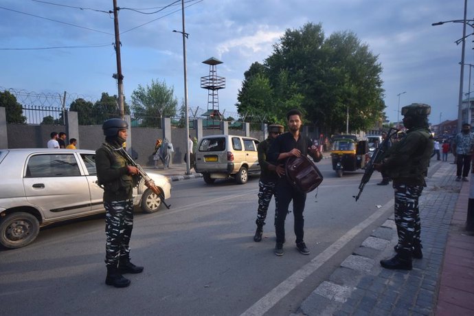 June 14, 2024, Srinagar, Jammu And Kashmir, India: Security personnel check the bag and vehicle of locals during a surprise search operation. Security has been beefed up in the valley ahead of Prime Minister Narendra Modi's visit ahead of International Yo