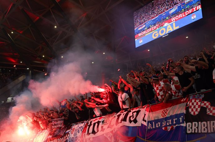 24 June 2024, Saxony, Leipzig: Croatia fans celebrate their side's first goal in the stands during the UEFA Euro 2024 group B soccer match between Croatia and Italy at Leipzig Arena. Photo: Jan Woitas/dpa