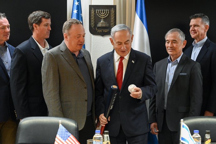 HANDOUT - 27 June 2024, Israel, Tel Aviv: Prime Minister of Israel Benjamin Netanyahu (C) meets with Jewish Institute for National Security of America (JINSA) Delegation of Generals and Admirals at the Kirya in Tel Aviv.