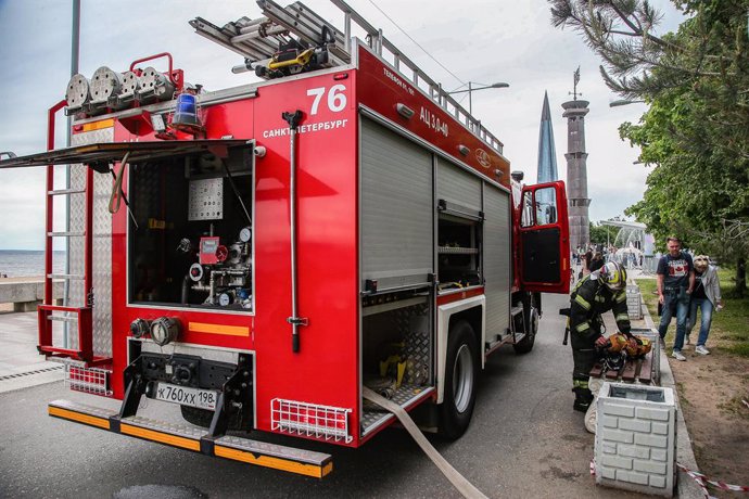 June 14, 2024, St. Petersburg, Russia: A fire service vehicle seen during the firemen's festival in the 300th Anniversary Park against the background of the building of the public and business complex with the headquarters of the Gazprom group Lakhta Cent