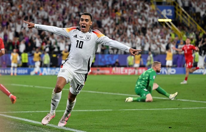 29 June 2024, North Rhine-Westphalia, Dortmund: Germany's Jamal Musiala celebrates scoring his side's second goal during the UEFA Euro 2024 round of 16 soccer match between Germany and Denmark at Dortmund stadium. Photo: Bernd Thissen/dpa