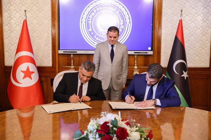 TRIPOLI, June 12, 2024  -- Libyan Interior Minister Emad al-Tarabelsi (R) and Tunisian Interior Minister Khaled Nouri (L) sign a security agreement in Tripoli, Libya, on June 12, 2024. The Ras Ajdir border crossing, a vital land link between Libya and Tun