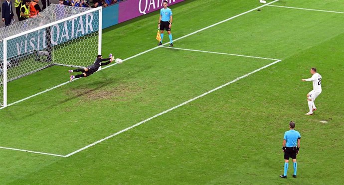 Portugal goalkeeper Diogo Costa (L) saves the penalty shot from Slovenia's Josip Ilicic (R) in the penalty shoot-out during the UEFA Euro 2024 round of 16 football match between Portugal and Slowenien at the Frankfurt Arena