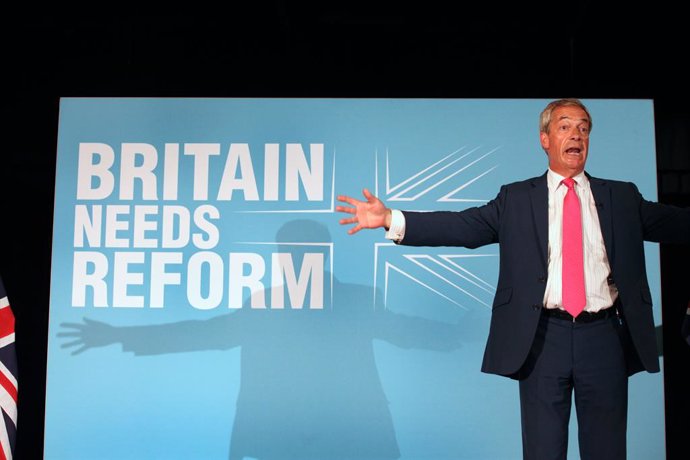 June 27, 2024, Boston, England, United Kingdom: Party Leader NIGEL FARAGE  stands in front of party slogan â€Britain Needs Reform' as he talks to a packed hall and encourages them to vote Reform UK. As Party Leader NIGEL FARAGE joins Party Chairman RICHA