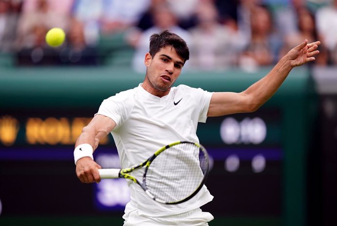 03 July 2024, United Kingdom, London: Spanish tennis player Carlos Alcaraz in action against Australia's Aleksandar Vukic during their men's singles second round match of the 2024 Wimbledon Championships at the All England Lawn Tennis and Croquet Club. Ph