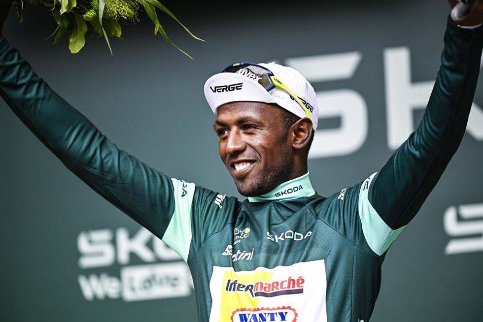 03 July 2024, France, Saint-Vulbas: Eritrean cyclist of Intermarche-Wanty team Biniam Girmay Hailu celebrates on the podium after the 5th stage of the 111th edition of the Tour de France cycling race, 177,5 km between Saint-Jean-de-Maurienne and Saint-V