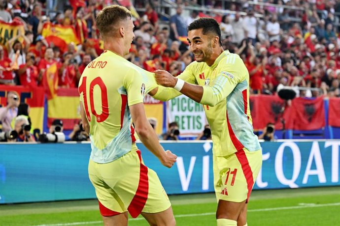 Spain's Ferran Torres (R) celebrates scoring his side's first goal with teammate Dani Olmo during the UEFA Euro 2024 group B soccer match between Albania and Spain at Duesseldorf Arena