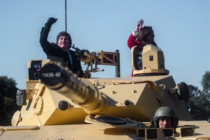 09 July 2024, Argentina, Buenos Aires: Argentine President Javier Milei (L) and his Vice President Victoria Villarruel stand on a military tank during a military parade to celebrate Independence Day.