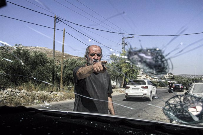 June 18, 2024, Nablus, Palestine: A Palestinian man inspects Palestinian cars that were vandalized by Jewish settlers assailants, in the village of Burin, south of the city of Nablus in the West Bank.,Image: 882760105, License: Rights-managed, Restriction