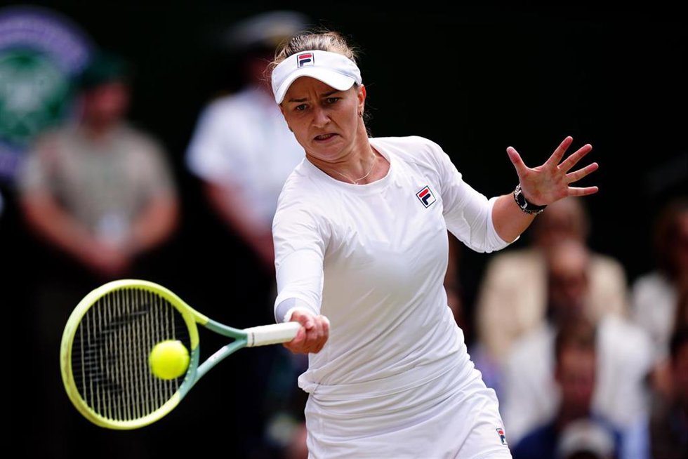 13 July 2024, United Kingdom, London: Czech tennis player Barbora Krejcikova in action against Italian tennis player Jasmine Paolini in the Ladies Singles final on day thirteen of the 2024 Wimbledon Championships at the All England Lawn Tennis and Croqu