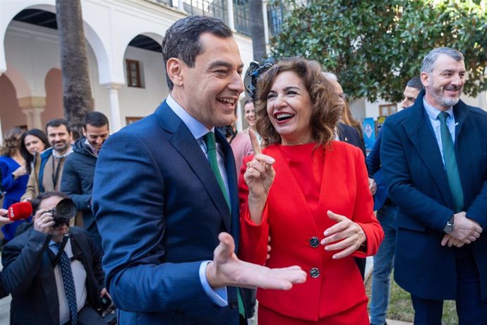 Archivo - La vicepresidenta primera del Gobierno y ministra de Hacienda, María Jesús Montero, saluda al presidente de la Junta de Andalucía, Juanma Moreno, a 28 de febrero de 2024 en Sevilla.