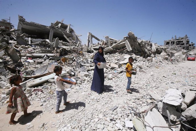 June 17, 2024, Khan Younis, Gaza Strip, Palestinian Territory: A Palestinian woman, Nisreen Abu Kashef, is taking care of her children inside part of her family's home that was destroyed during the Israeli army's attack on the Khan Yunis camp, on 18 June 