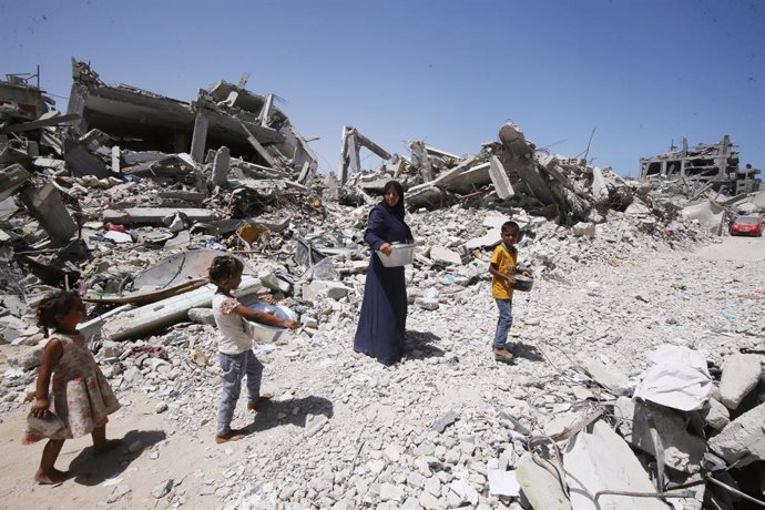 June 17, 2024, Khan Younis, Gaza Strip, Palestinian Territory: A Palestinian woman, Nisreen Abu Kashef, is taking care of her children inside part of her family's home that was destroyed during the Israeli army's attack on the Khan Yunis camp, on 18 June 