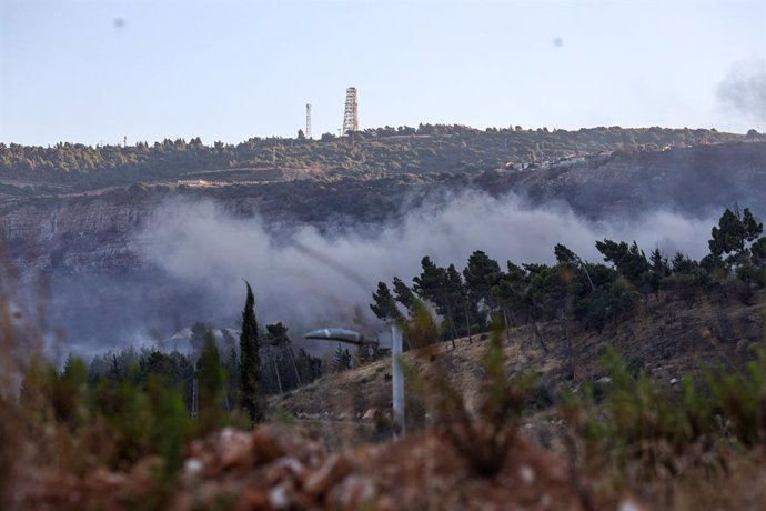 KIRYAT SHMONA, July 16, 2024  -- Smoke billows following missile attacks from Lebanon, in the city of Kiryat Shmona, northern Israel, on July 16, 2024. Hezbollah announced on Tuesday in a statement that it attacked the Israeli Kiryat Shmona settlement wit