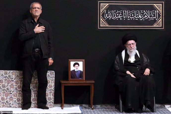 July 12, 2024, Tehran, Iran: Iranian Supreme Leader Ayatollah ALI KHAMENEI (R) and Newly elected Iranian President MASOUD PEZESHKIAN (L) attend the first night of mourning ceremonies for the martyr of Husayn ibn Ali, The grandson of the Islamic prophet Mu